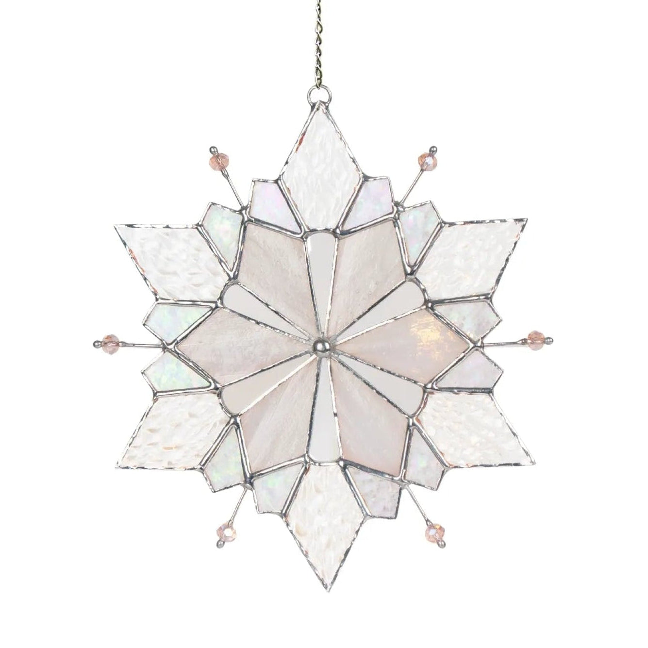 Stained glass snowflake with oink beads hanging on a chain white background