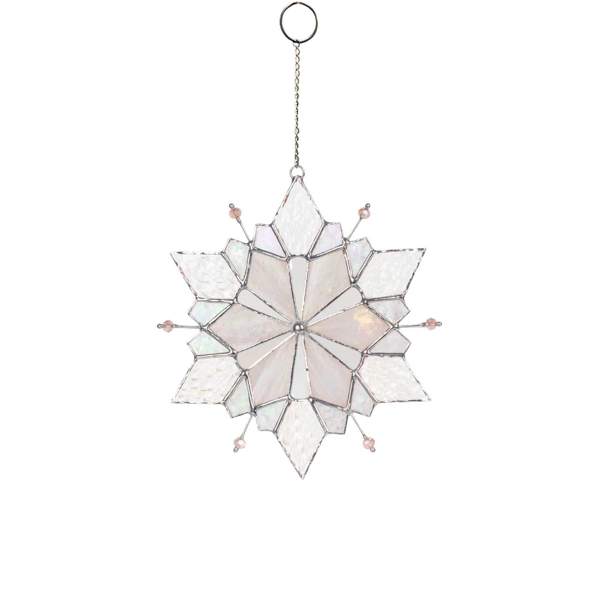 Stained glass snowflake with oink beads hanging on a chain white background