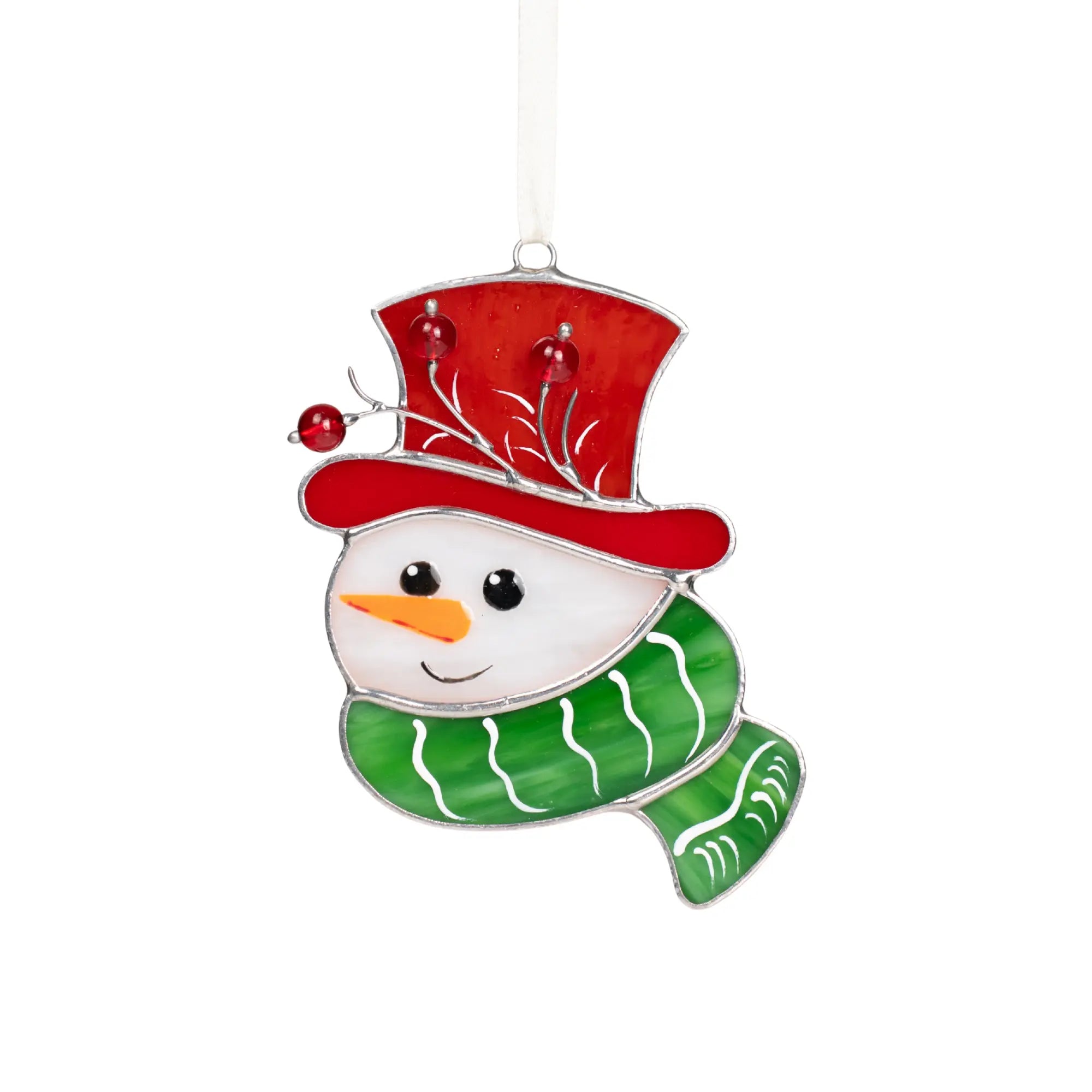 Smiling stained glass snowman wearing a red hat with red beads and a green scarf, hanging on a ribbon.