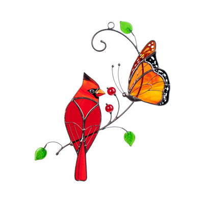 Pair of monarch and cardinal on a curved branch with green glass leaves and red beads.