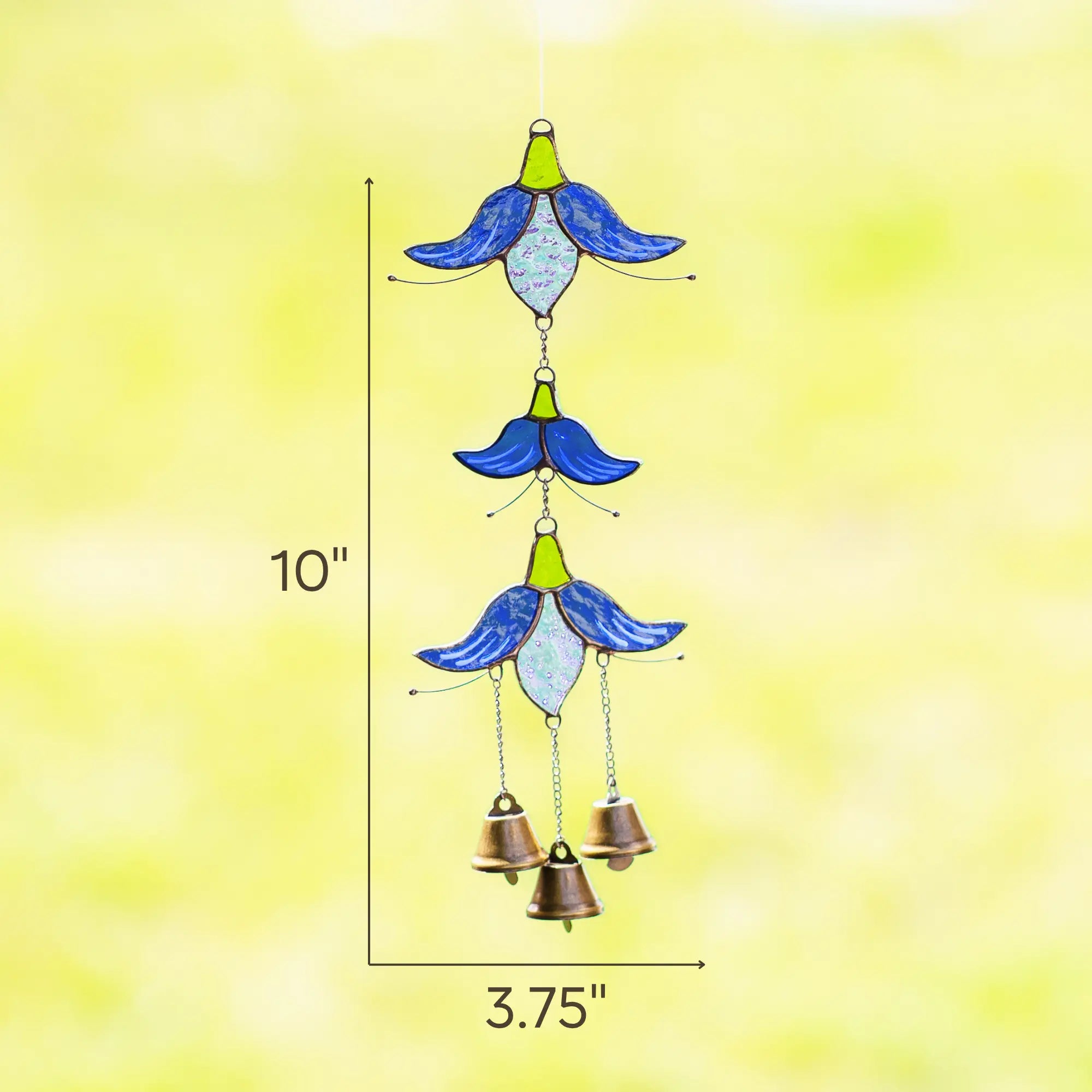 Stained glass flower wind chime measuring 10 inches tall and 3.75 inches wide against a blurred green background.