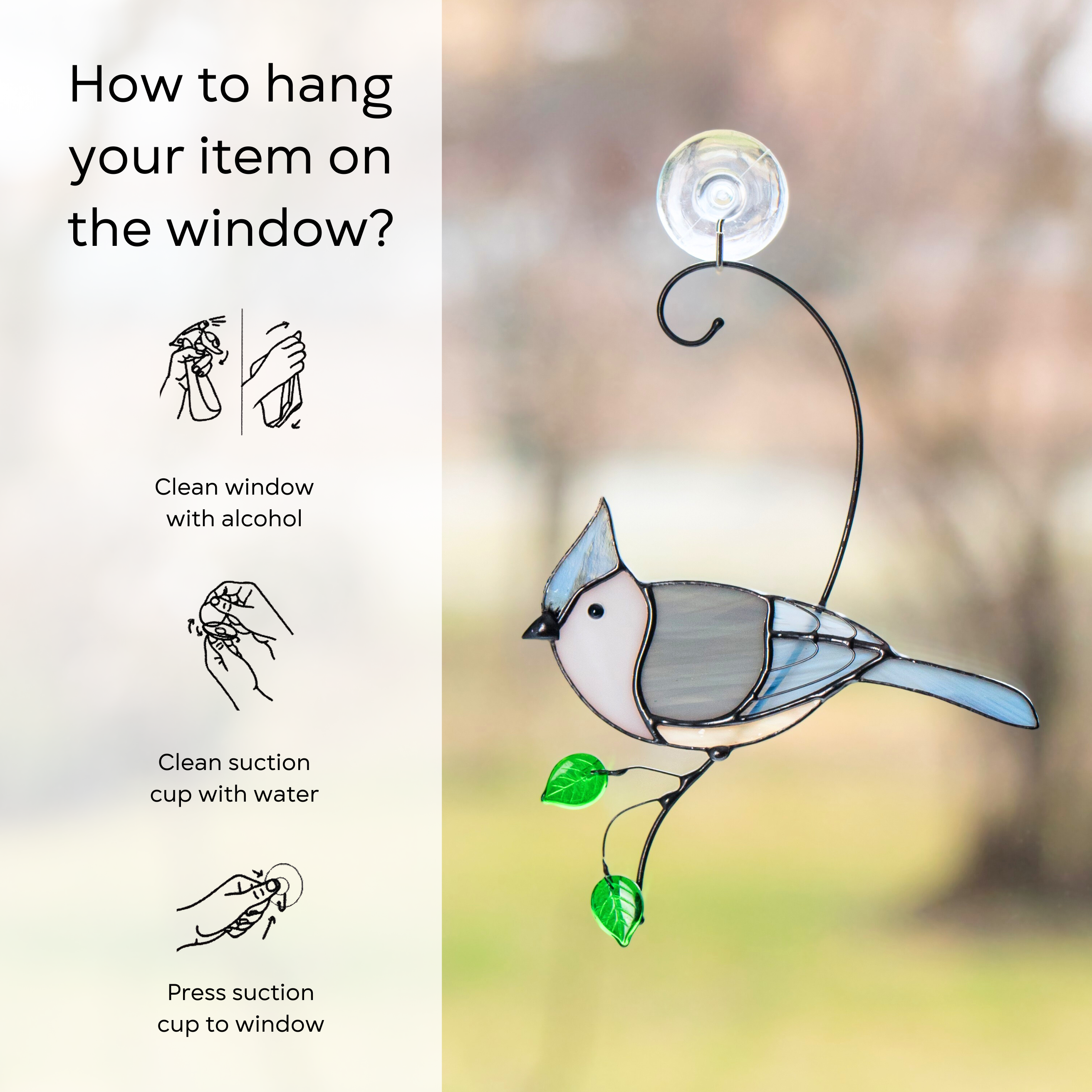 A stained glass tufted titmouse hanging on a rainy window using a suction cup, green leaves below, with instruction: clean window and suction cup, press a cup to the surface.
