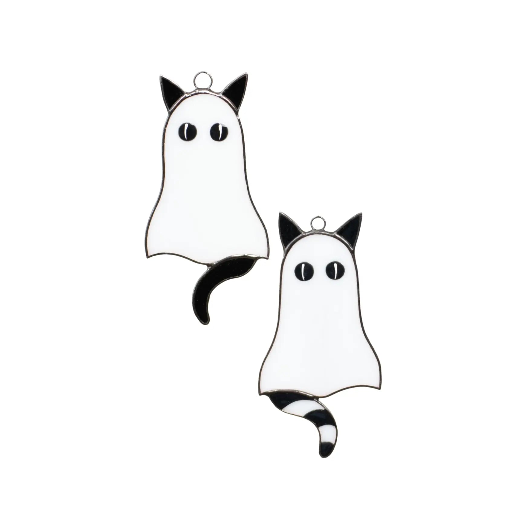 Two black and white cat-ghost suncatchers on a white background
