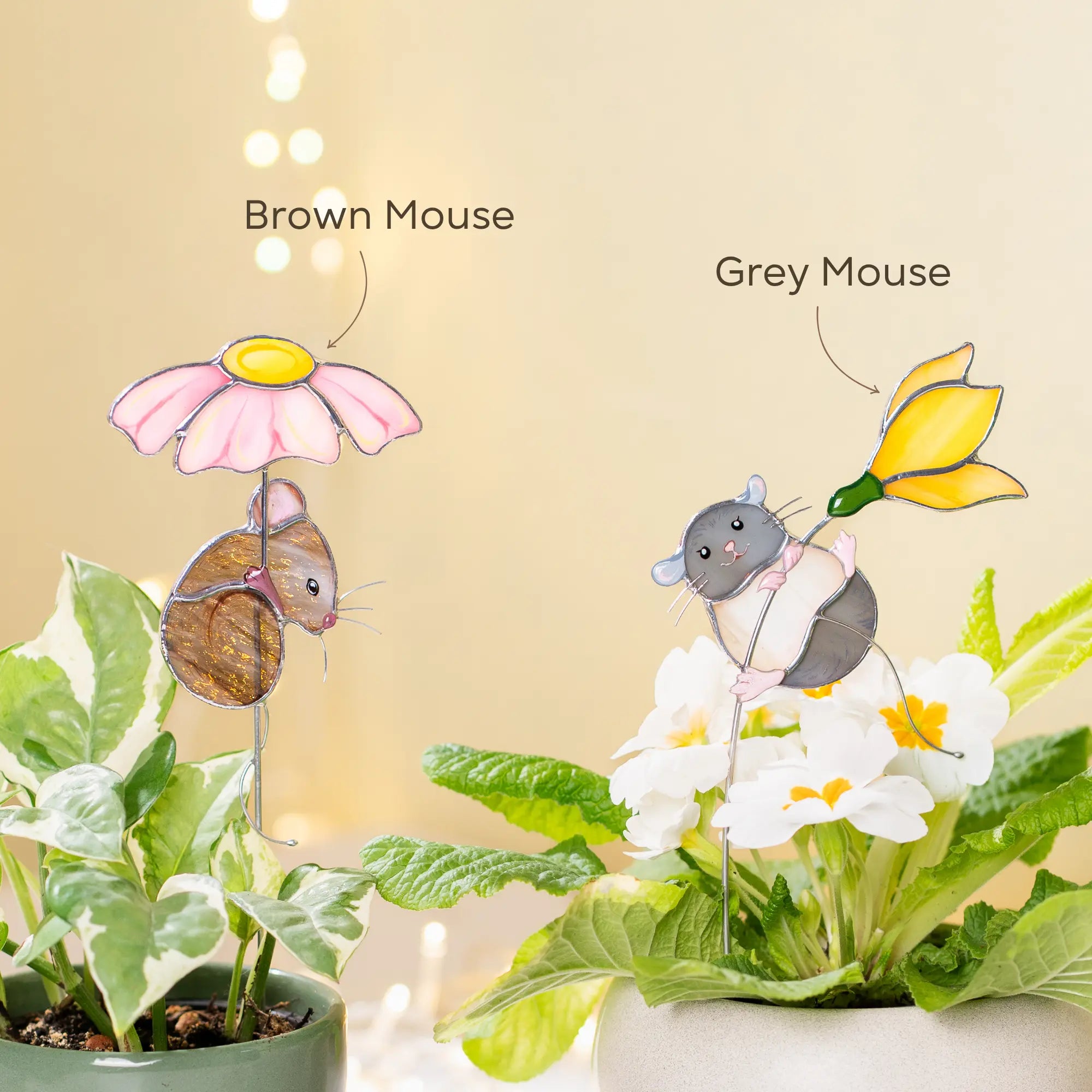 Variation of two decorative mouse plant stakes with labels for brown and grey mice against a light background.