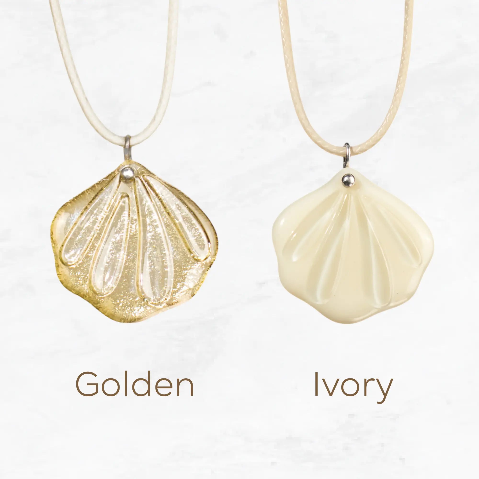Variation of two stained glass shell fan  necklaces in golden and ivory colors