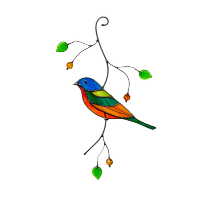 Stained glass bunting bird in vivid colors hanging with decorative glass leaves and beads.