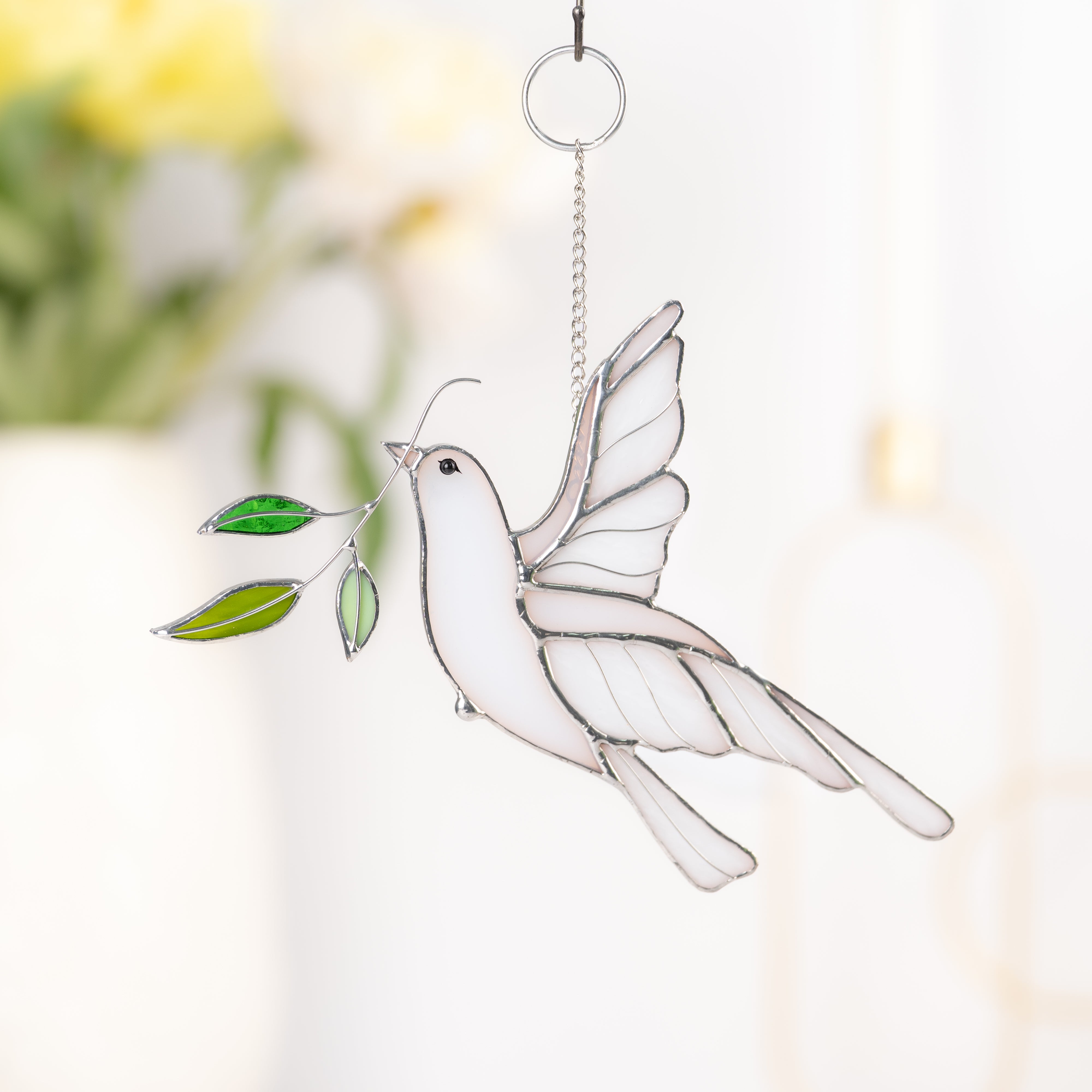 Stained glass dove with green glass leaves 