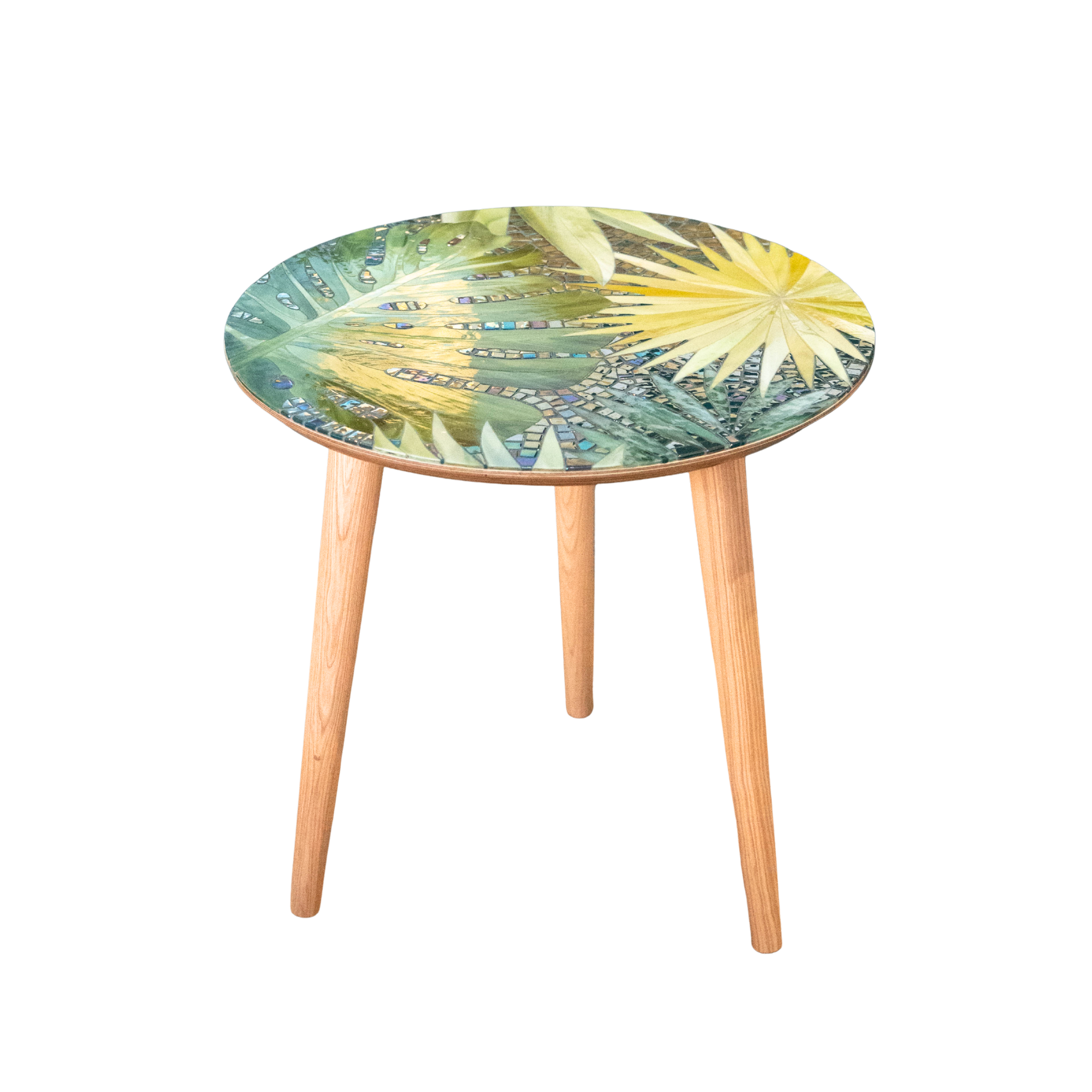 Wooden table with stained glass mosaic top featuring monstera leaves 