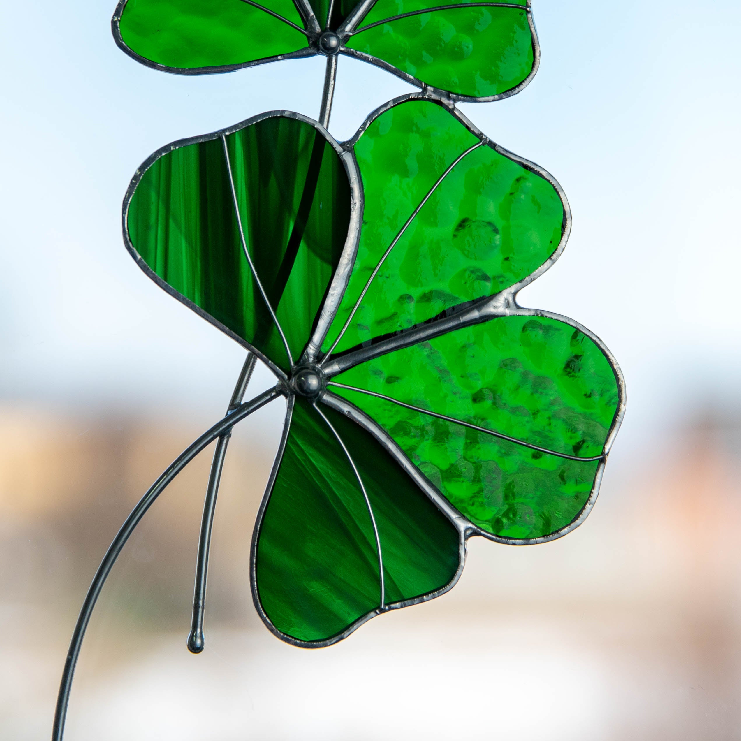Close-up view details of green clover stained glass suncatcher 