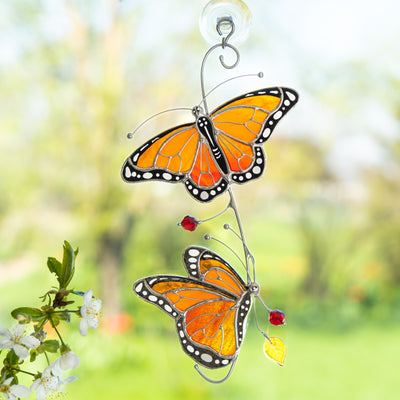 Stained glass suncatcher of two monarch butterflies 