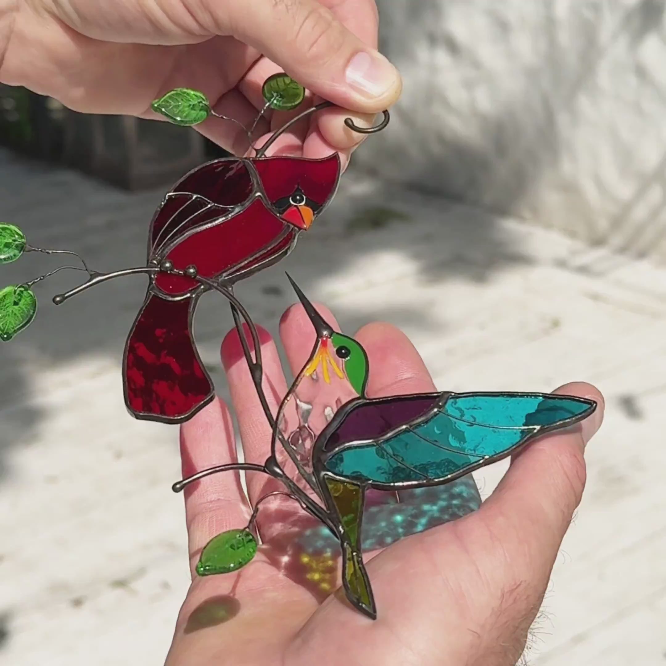 Stained glass suncatcher featuring pair of hummingbird and cardinal