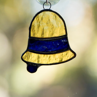 Stained glass yellow bell with a navy insert suncatcher for Christmas decor