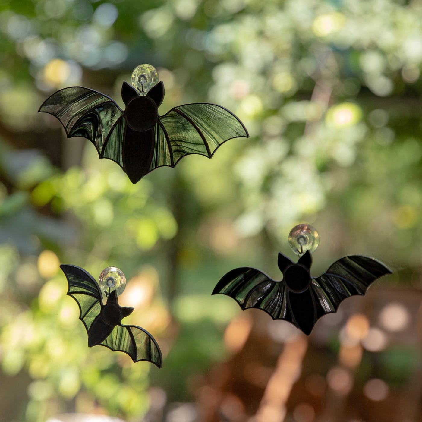 A set of three stained glass vampire bats Halloween suncatchers