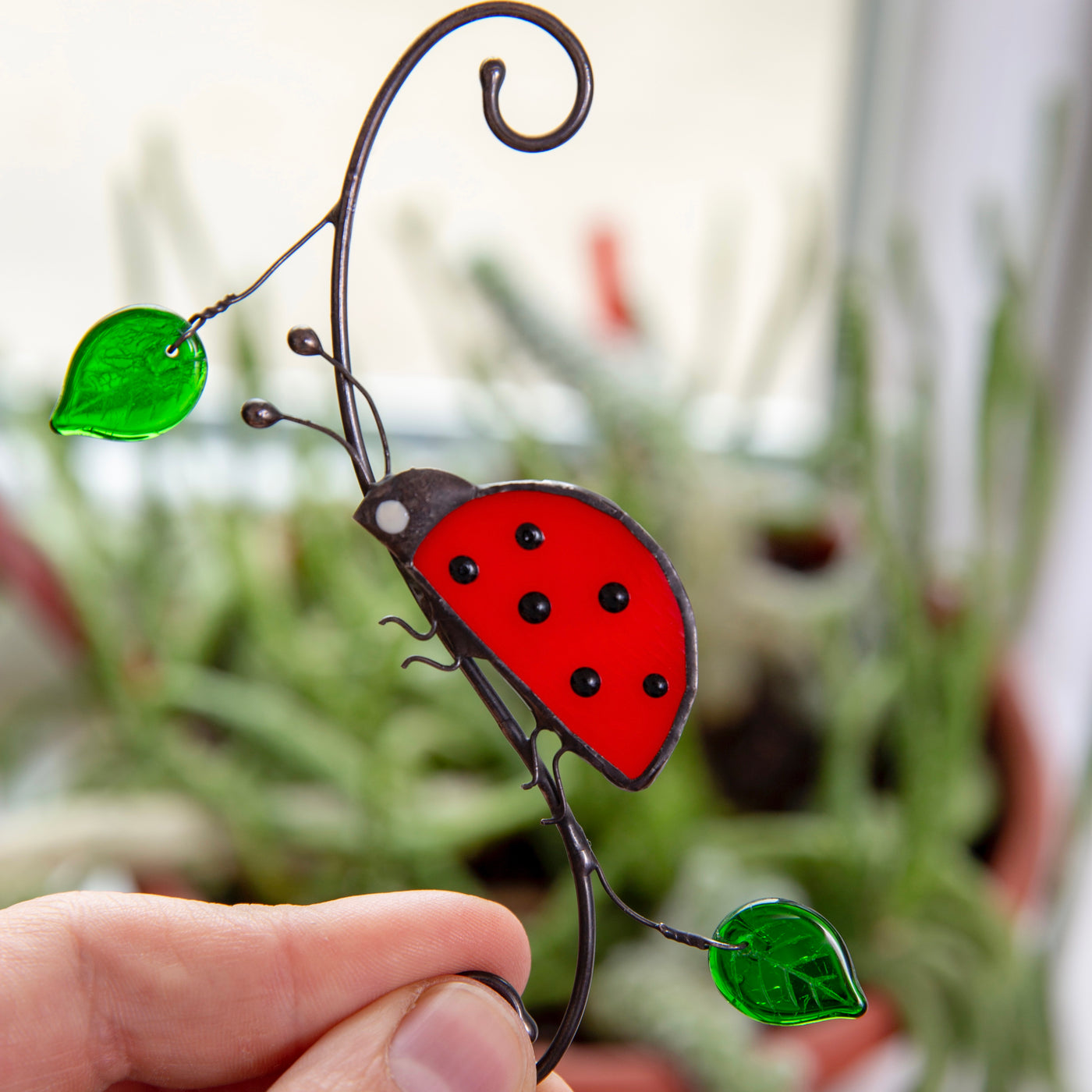 Side-view red ladybug suncatcher of stained glass