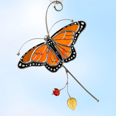 Stained glass flying on the branch monarch butterfly window hanging