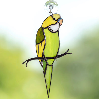 Stained glass green budgerigar on the branch suncatcher