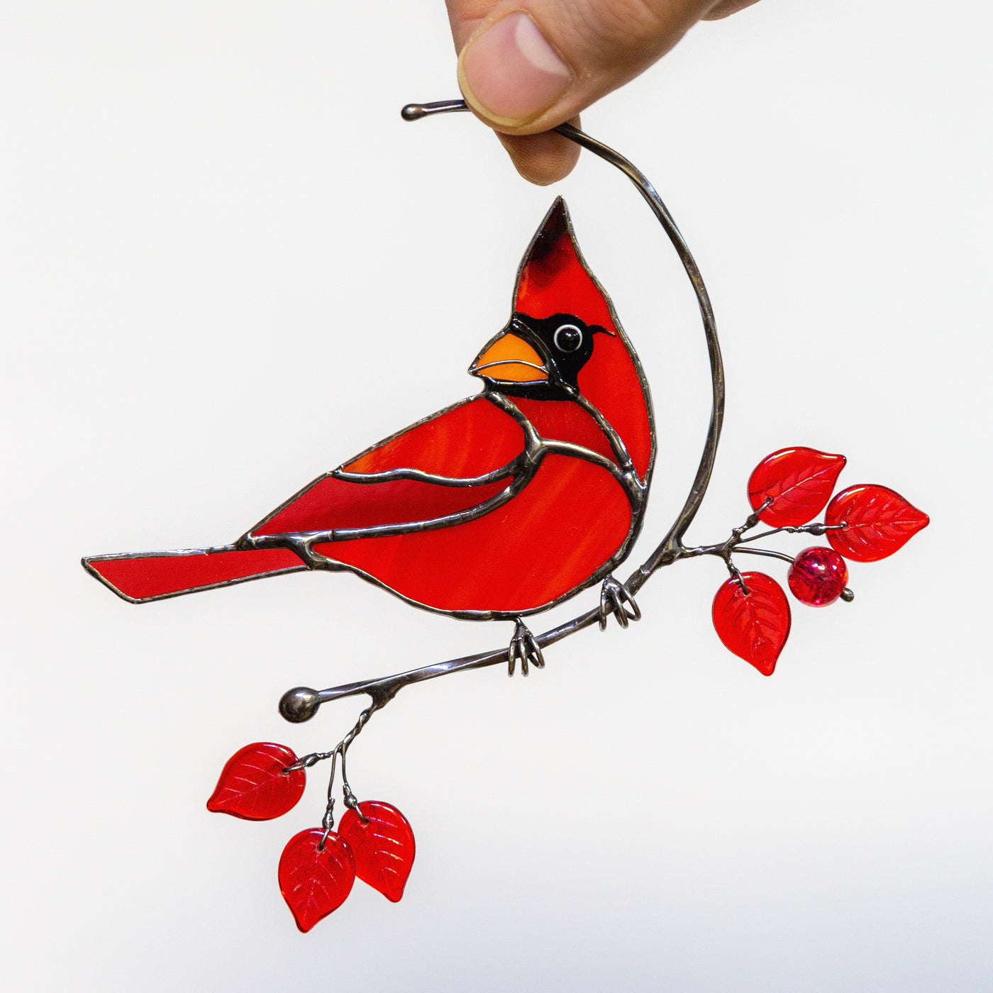 Redbird sitting on the branch stained glass window hanging