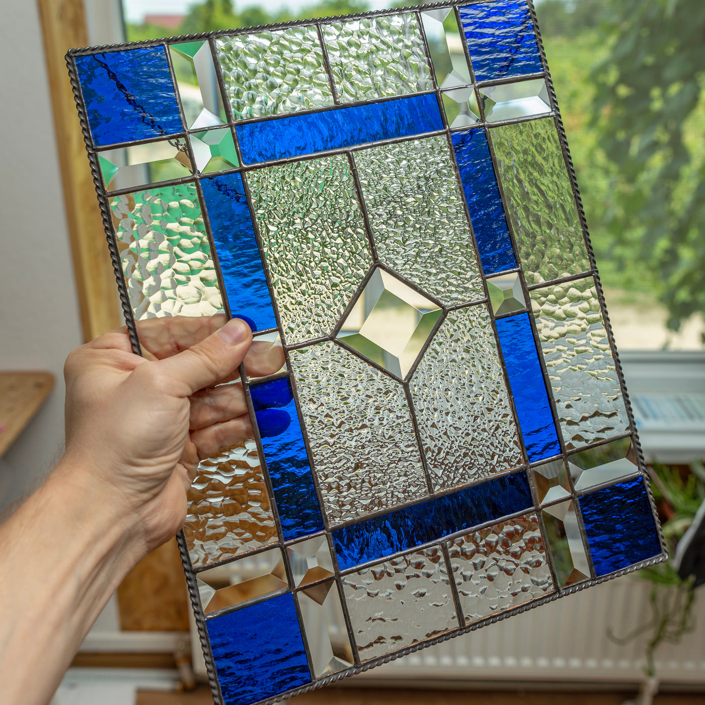 Stained glass clear panel with cobalt and beveled inserts