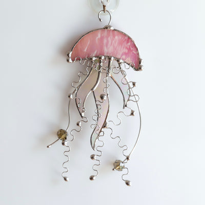Pink stained glass jellyfish with iridescent tentacles window hanging 