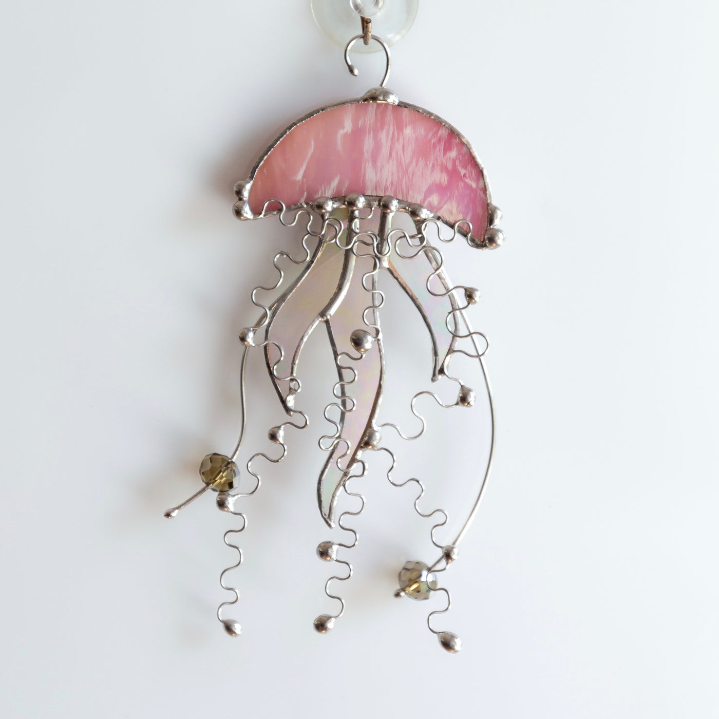 Stained glass pink jellyfish with iridescent tentacles suncatcher