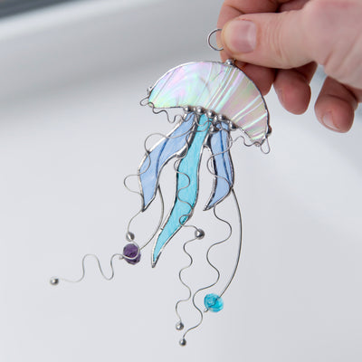 Stained glass jellyfish with blue tentacles suncatcher