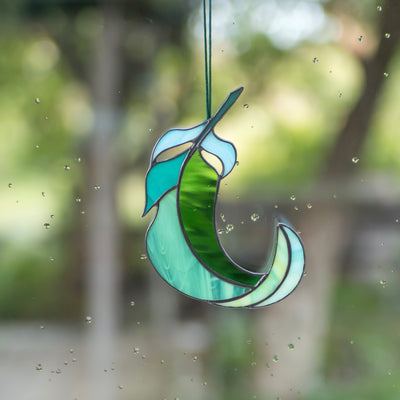 Green and its shades stained glass bending right feather suncatcher