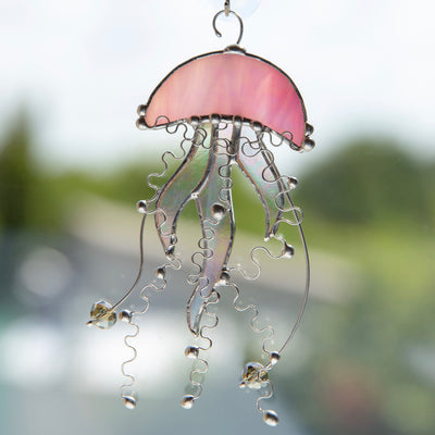 Stained glass pink jellyfish window hanging with iridescent tentacles 