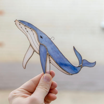 Stained glass whale of a blue colour suncatcher for window