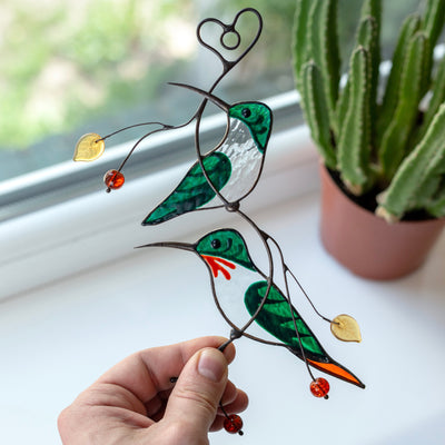 Green hummingbirds sitting on the branch stained glass window hanging