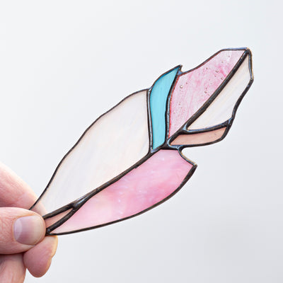 Stained glass pink with a blue part feather suncatcher