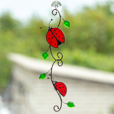 Two ladybugs sitting on the branch stained glass suncatcher
