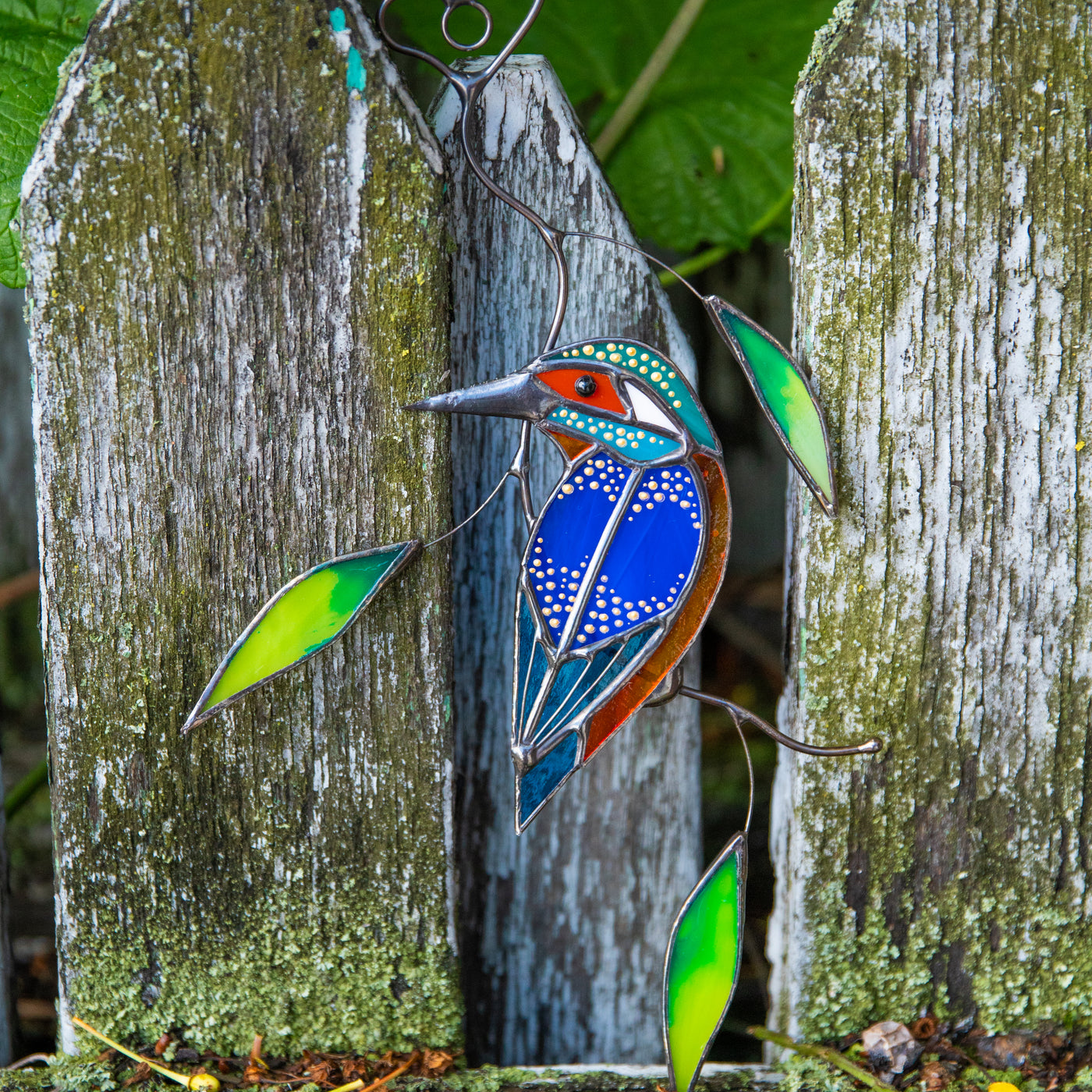 Stained glass suncatcher of a kingfisher on the branch