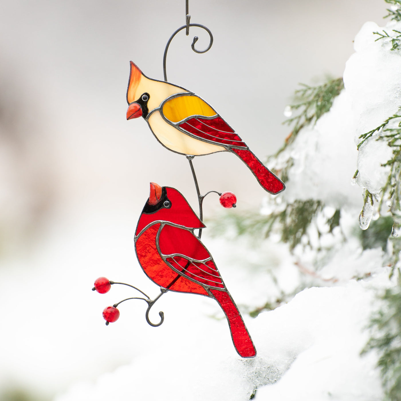 Stained glass cardinals looking at each other on the branch with beads suncatcher.