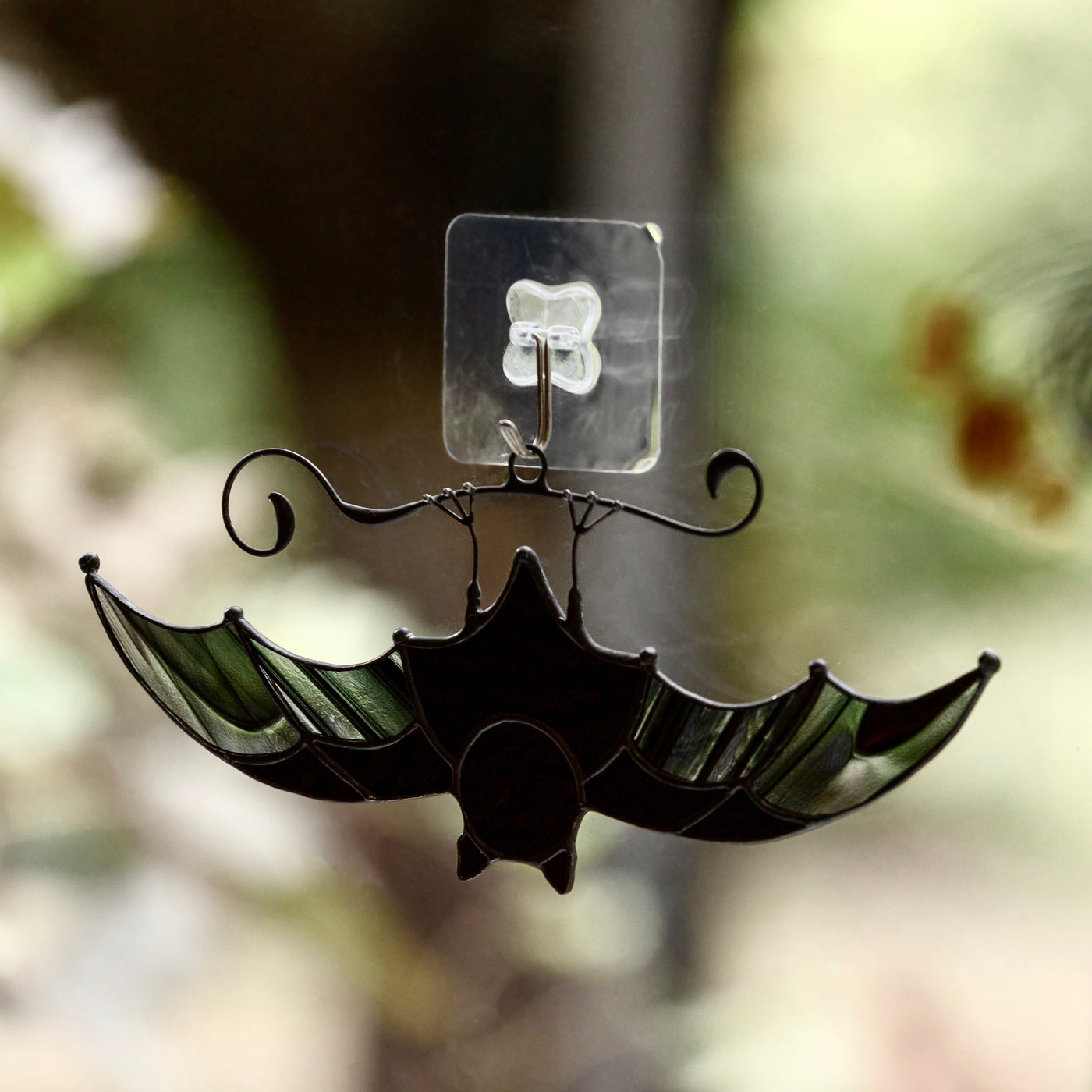 Black-and-clear stained glass bat suncatcher for Halloween celebrations
