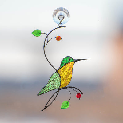 Green hummingbird with yellow belly window hanging of stained glass
