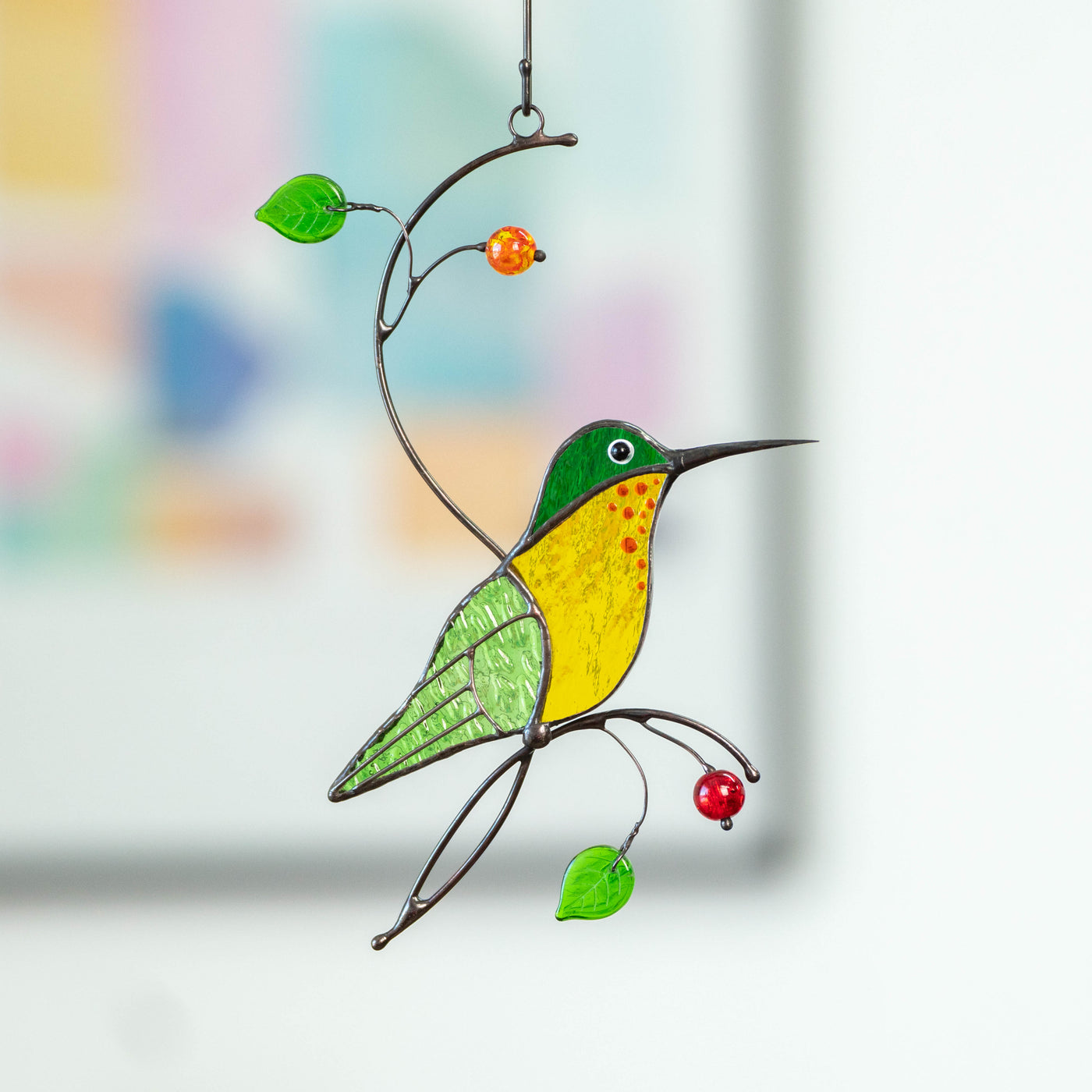 Stained glass green hummingbird with yellow belly suncatcher