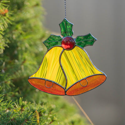 Zoomed stained glass yellow christmas bells 