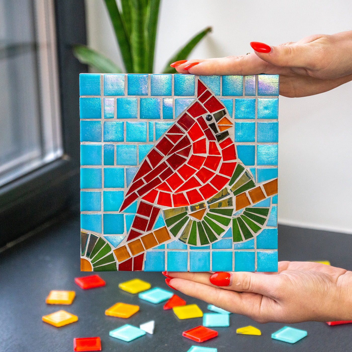 Red cardinal on blue background glass mosaic 