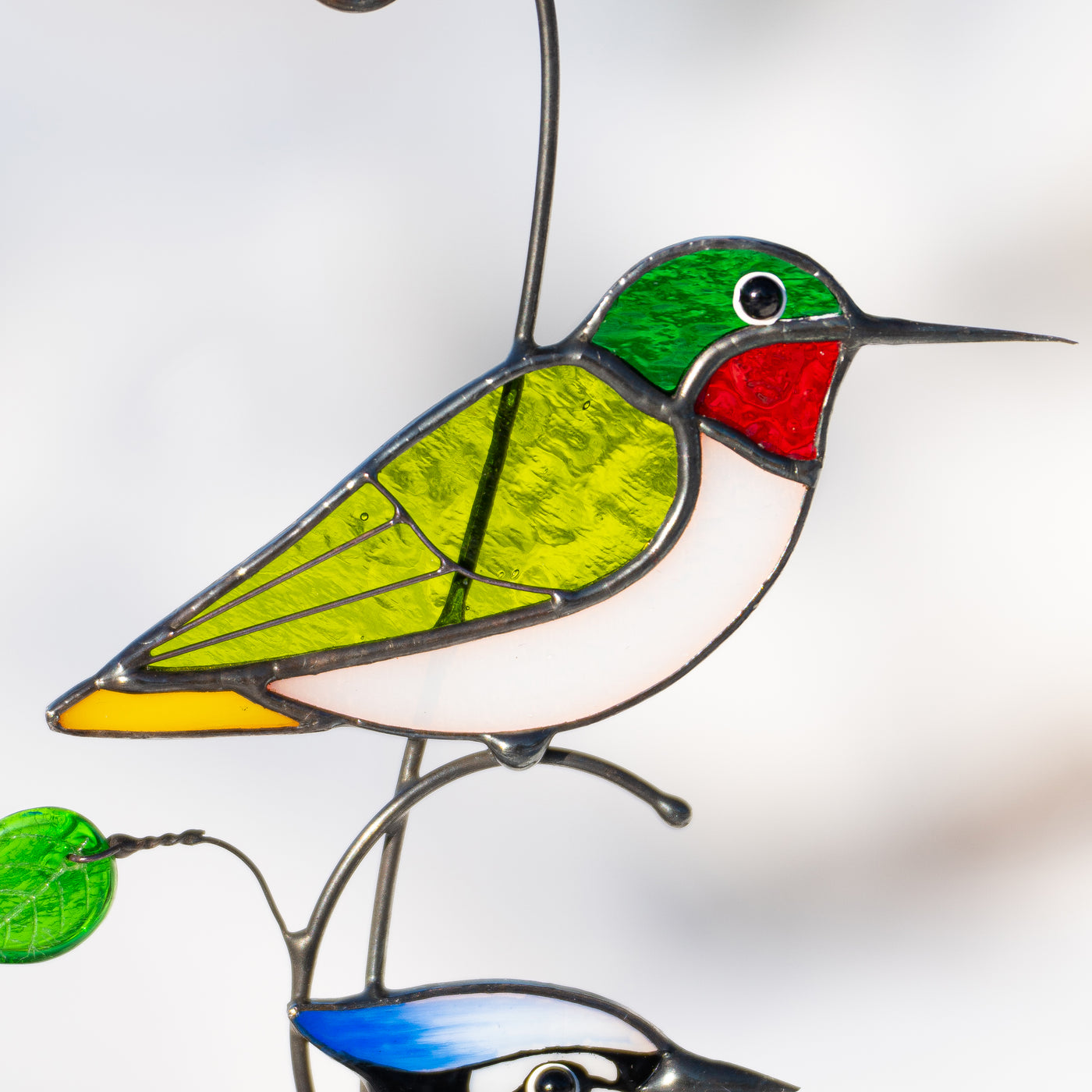 Stained glass zoomed hummingbird 