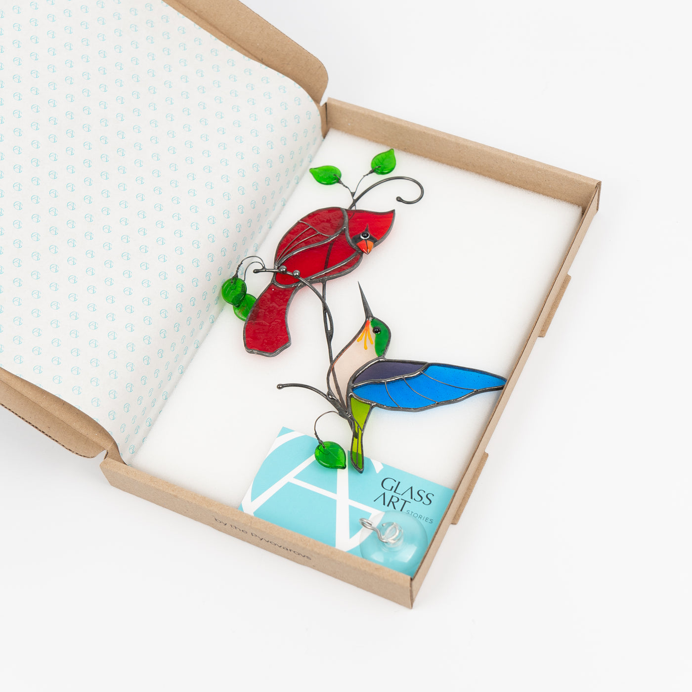 Stained glass suncatcher of cardinal and hummingbird in a brand box