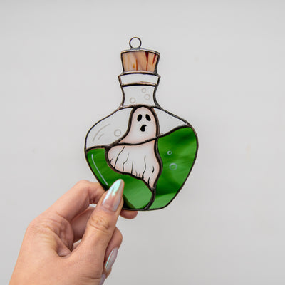 Stained glass window hanging of ghost in the bottle for Halloween decor