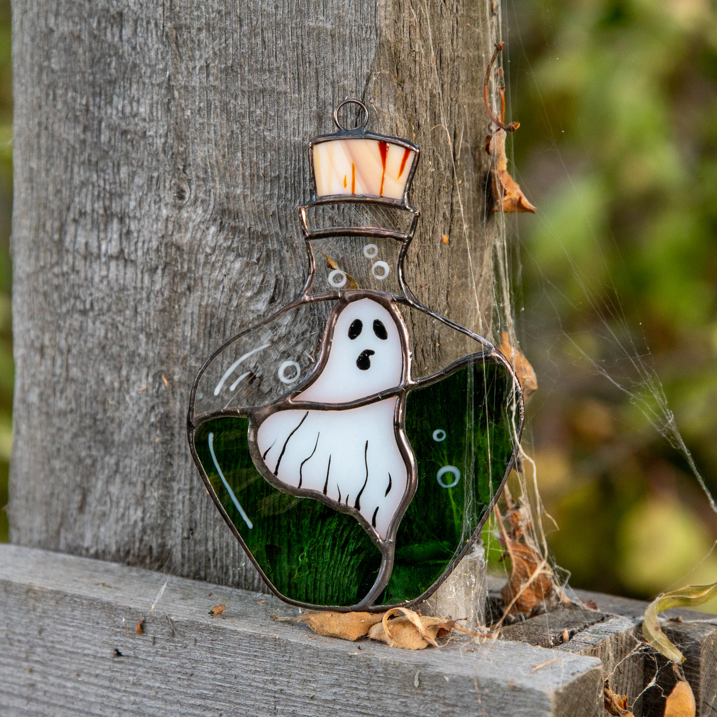 Stained glass ghost in the bottle suncatcher for spooky Halloween decor
