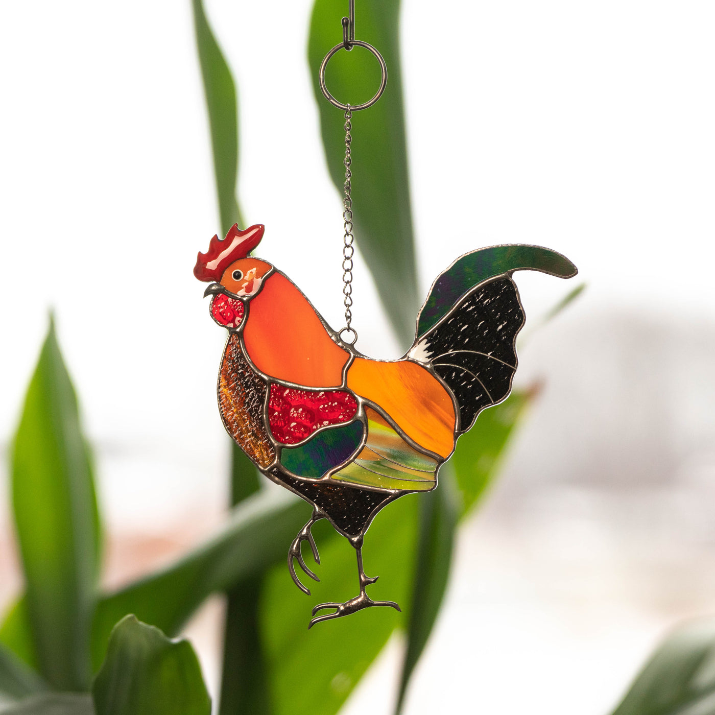 Bright rooster with iridescent tail suncatcher of stained glass