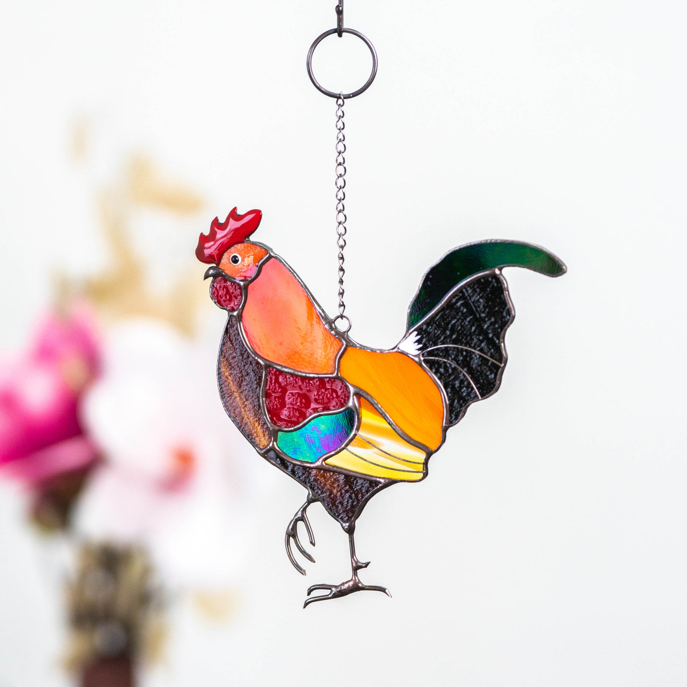 Colorful stained glass suncatcher of a rooster