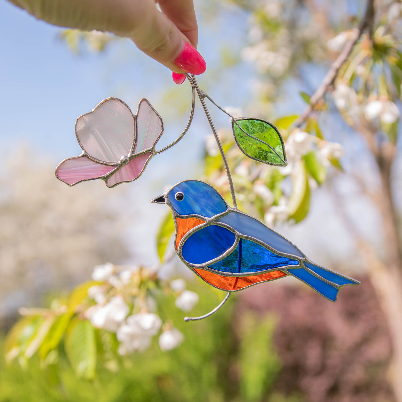 Bluebird with pink flower sun catcher of stained glass