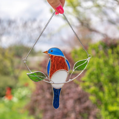 Stained glass bluebird sitting on the chain suncatcher