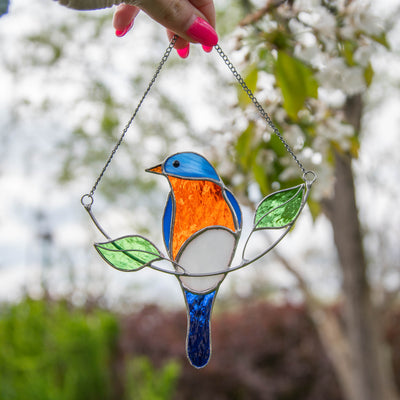 Stained glass bluebird on the chain window hanging