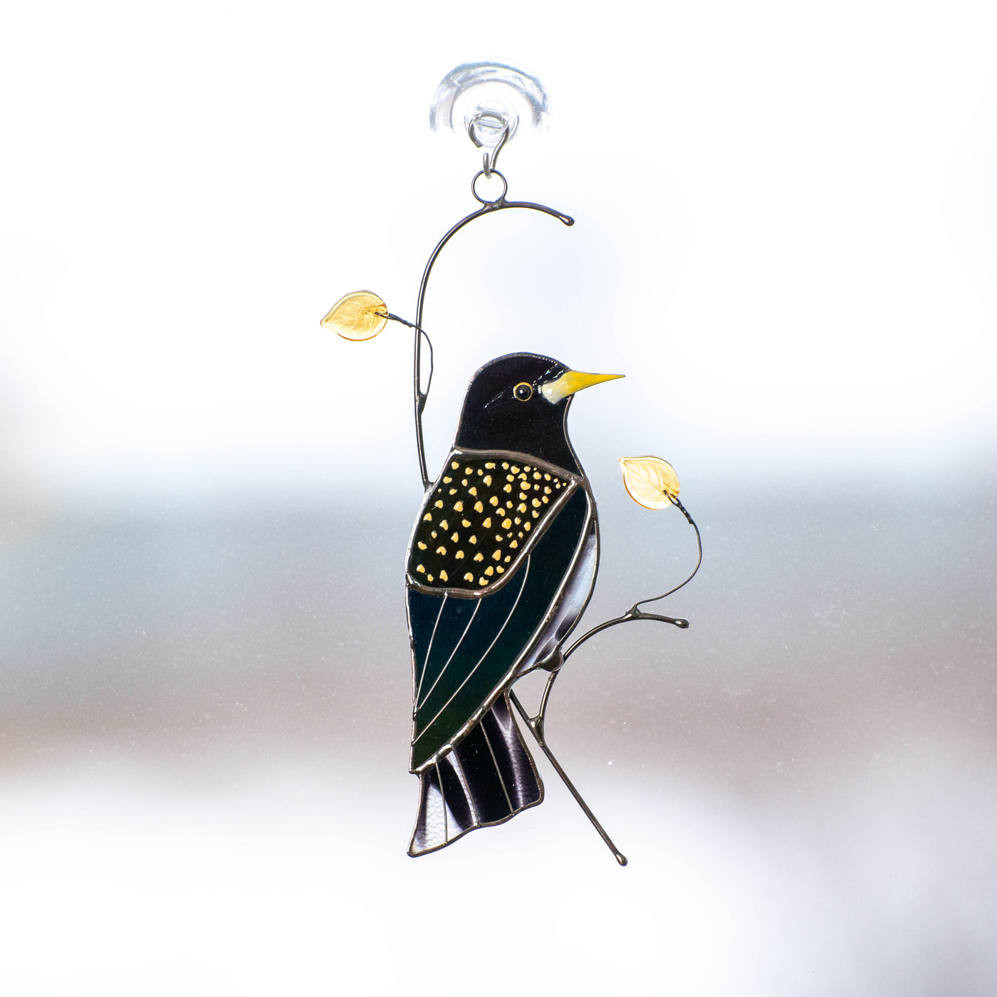 Stained glass European starling bird with iridescent parts suncatcher