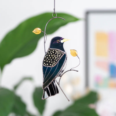 Iridescent European starling bird window hanging of stained glass