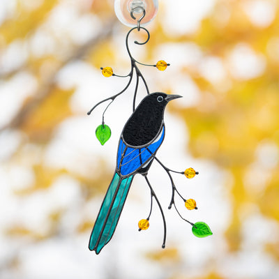 Stained glass suncatcher of a magpie